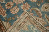 Malayer runner corner revealing hand-knotted reverse, secured side, and distressed floral design.