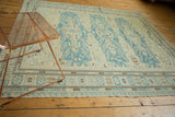 Antique style Soumac carpet featuring slate blue medallions and pomegranate border design.