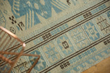 Fine weave antique-style Soumac rug with ivory, slate blue, and brown geometric patterns.