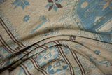 Fine weave texture with slate blue, ivory, and chocolate brown geometric starbursts.