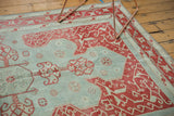 Vintage Oushak rug corner with elaborate faded cherry red vinery motif, powder blue field, even wear.