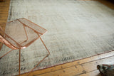 Distressed vintage Oushak carpet with visible foundation and faint floral patterns.