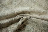 Distressed aesthetic texture on vintage Oushak carpet, showing hard wear and exposed foundation.
