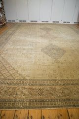 Distressed Sivas carpet border, featuring intricate dark geometric and curvilinear patterns.