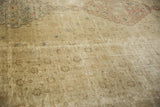 Distressed Sivas carpet texture with repeating pale floral motifs and even wear.