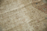 Distressed vintage Sivas carpet pile, with mostly even wear and faint floral motifs.
