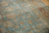 Distressed Tabriz carpet with faded sapphire blue and detailed scrolling vinery.