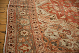 Evenly worn pile and floral border detail of a vintage distressed Persian Khoy carpet.