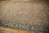 Distressed Mehrivan carpet with faded samovar border and geometric floral field pattern.
