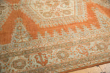 Pale rust and ivory distressed Persian Veece rug with geometric patterns and worn texture.