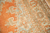 Detailed texture of vintage distressed Veece carpet, with pale rust and slate grey over faint foundation.