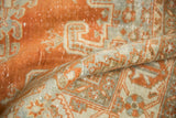 Distressed Veece carpet pile showing even wear, rust tangerine, grey, and ivory geometric motifs.