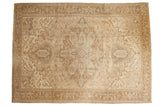 Distressed vintage Heriz carpet, stepped medallion, geometric pattern in bronze and beige.
