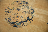 Love birds on elongated branches in the pictorial central medallion, showing worn, low pile.