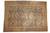 Vintage distressed Mahal rug with an oversized allover pattern of scrolling vinery on a charcoal black field.