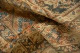 Soft folds of a distressed Mahal carpet highlight its low, even pile and time-softened colors.