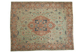 Vintage Distressed Tabriz rug with seafoam green field, pale rust medallion, and softened patterns.