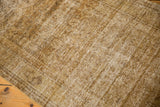 Distressed vintage Hamadan runner with heavy abrash, worn pile, and exposed antique ivory foundation.