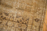 Distressed vintage Hamadan runner pile with visible foundation and soft Herati motif.