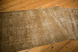 Distressed texture and abrash on partially rolled vintage Hamadan runner.