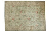 Distressed vintage Tabriz carpet, seafoam green allover floral lattice, terra cotta accents.