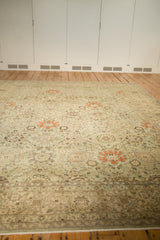 Distressed vintage Tabriz carpet border with faded floral vinery and even wear.