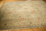 Fine floral vinery and border on a distressed vintage Tabriz carpet with soft, even wear.