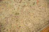 Distressed vintage Tabriz carpet border with faded seafoam green vinery and floral motifs.