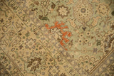 Distressed vintage Tabriz carpet with seafoam green, beige, terra cotta floral vinery detail.