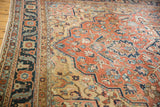 Unusually fine antique Serapi carpet detail with delicate vinery, floral cross-sections, and madder red field.