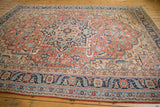 Antique Persian Serapi carpet, intricate concentric medallions, delicate vinery, brick red, navy.