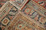 Folded antique Serapi carpet, intricate vinery, floral motifs, worn pile, beige fringe.
