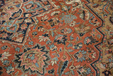 Detailed antique Serapi rug field with delicate floral vinery in madder red, navy, and sky blue.