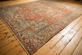 Geometric floral design of a Vintage Distressed Heriz Carpet with dusty rust and powder blue.