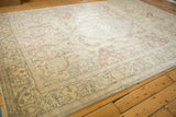 Distressed Tabriz rug border, showing foundation, softened ivory, and Rococo outlines.
