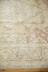 Distressed vintage Tabriz carpet showing pale ivory, dusty blush Rococo leaves and foundation.