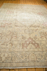 Vintage Distressed Tabriz carpet, even wear revealing Rococo scrolling leaves in ivory and pale raspberry.