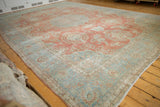 Vintage Distressed Mahal carpet with roundel medallion, floral sprays, and abrash in blush red and powder blue.