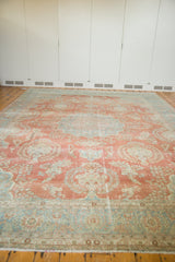 Vintage Mahal rug border with sky blue motifs and distressed coral floral field.