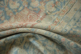 Distressed Mahal carpet showing worn pile, faint foundation, and muted blue, red, ivory.