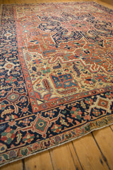 Antique Heriz carpet border, showing navy ground, brick red, and green geometric vinery.