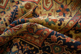 Antique Heriz carpet: geometric vinery, floral motifs in navy, brick red, saffron.