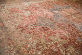 Distressed vintage Heriz carpet texture: raspberry red, dusty blue, seafoam green geometric vinery.