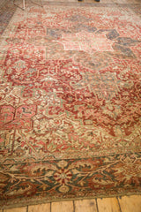 Distressed Heriz border and field with even wear, faded raspberry red, blue, ivory geometric vinery.