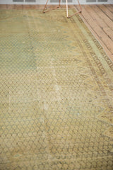 Distressed Malayer carpet with pale blue and beige boteh pattern, faint foundation visible.