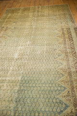 Distressed Malayer carpet with faded pale blue botehs, serrated diamonds, foundation wear.