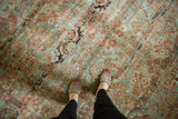 Distressed American Sarouk rug, Rococo floral bouquet, dusty teal, red hues, even wear.