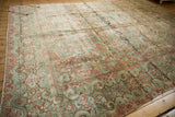 American Sarouk rug's expressive wide banded Rococo border with red florals on teal.