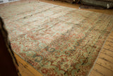 Artfully distressed texture of vintage Sarouk, showing faded wine red and dusty teal Rococo florals.