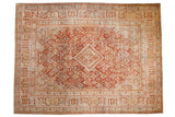 Distressed vintage Joshegan carpet with central diamond medallion and lattice field in cinnabar red, pale blue, ivory. 9x12